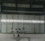 Zaprojektowane jednokierunkowe drzwi hangaru lotniczego Typowy projekt z furtką dostawca